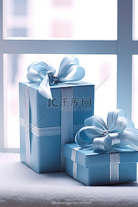 带婴儿礼物的蓝丝带礼品盒