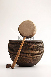 傳統樂器背景图片_棕色小碗顶部的木槌和鼓