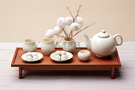 松装饰背景图片_茶几上装饰着茶包和茶壶