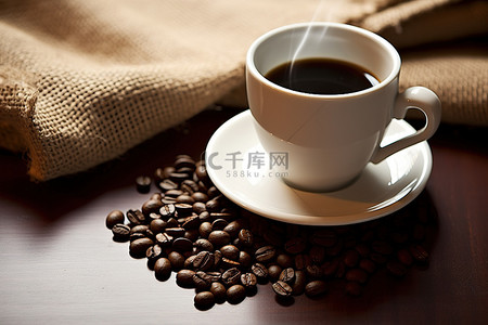 logo样机咖啡杯背景图片_咖啡杯，上面放着一袋咖啡豆