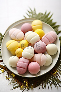 桌上甜点背景图片_白桌上的黄色和白色甜点