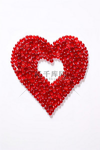 红色心形背景图片_红色珠子的心形显示在白色表面上
