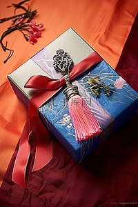 带有红色和蓝色丝带和日本书法的蓝色礼品盒