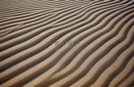 沙子堆背景图片_一堆沙子有很多线条的图片