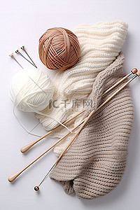球衣服背景图片_白色的纱线针织球和织针