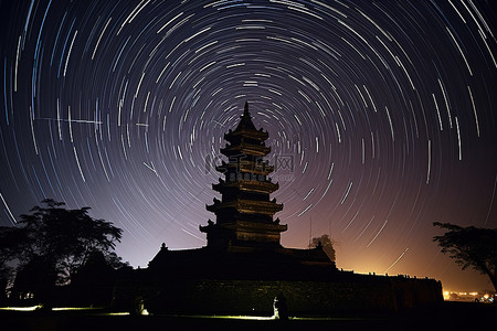 星星夜空背景图片_夜晚亚洲塔的星轨