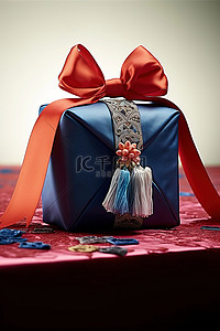 红色丝带蝴蝶结背景图片_带有红色丝带蝴蝶结的蓝色礼品袋