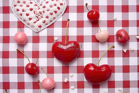 樱桃樱桃背景图片_情人节那天，格子桌布上有很多心和樱桃
