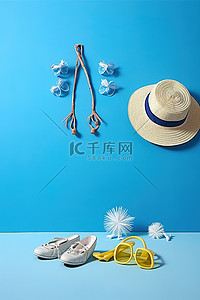 蓝衣服黄帽子背景图片_蓝色背景的海滩场景包括帽子太阳镜和其他材料