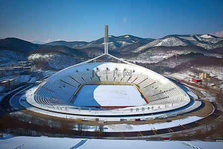 跳台滑雪背景图片_韩国冰雪覆盖的山腰奥林匹克体育场