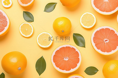 黄色背景水果背景图片_黄色背景上葡萄柚和橙子的排列