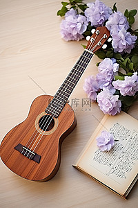 一把木制尤克里里琴打开的页面，旁边有一些花和一本笔记本