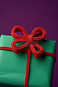红色包装背景图片_绿色背景上带有紫色蝴蝶结的红色包装礼物