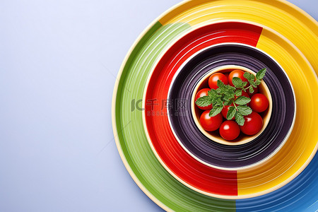 彩色种子背景图片_彩色盘子里的番茄种子