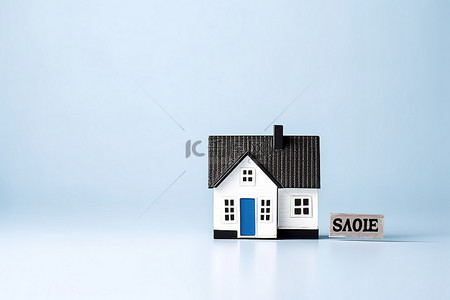 宅背景图片_蓝色背景的小住宅和销售标志