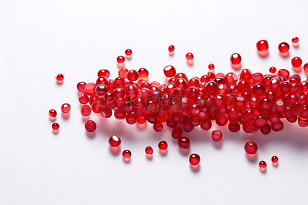 红色石榴背景背景图片_红色珠子与石榴在白色背景