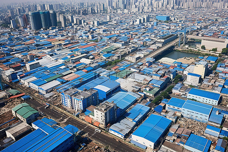 产业区背景图片_充满蓝色屋顶和工业建筑的城市的鸟瞰图