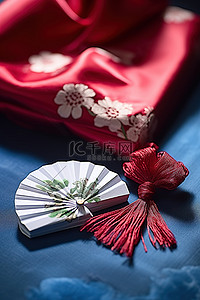 婚礼展背景图片_蓝色桌子上的礼物和扇子