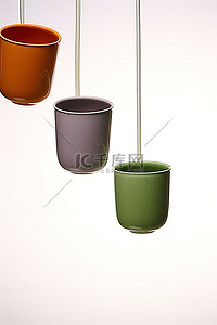 双11悬浮框背景图片_三个绿色紫色和橙色杯子悬浮在太空中