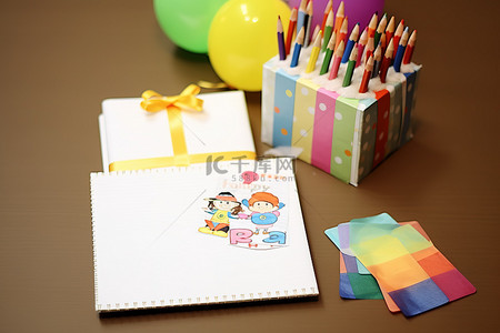 生日套装背景图片_包含蜡笔和彩纸的生日快乐礼物套装