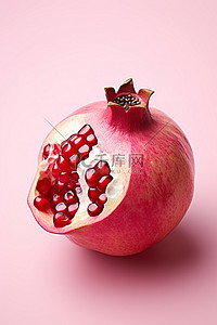 石榴水果背景图片_粉红色背景中的石榴