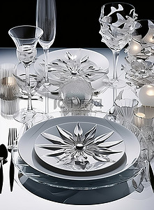 桌子上有灰银和白色的盘子杯子和银器