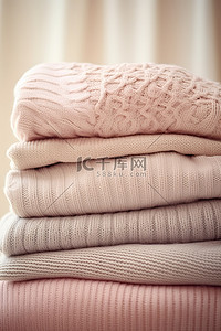 温暖毛衣背景图片_四件毛衣叠在一起