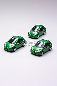 小汽车背景图片_绿色能源三辆写着字的小汽车