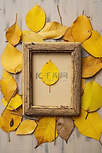枫叶小背景图片_一个小相框，周围散落着黄色的叶子
