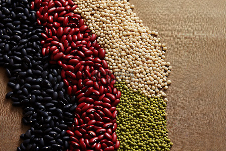 高粱背景图片_画布背景上的红黄绿和黑大豆