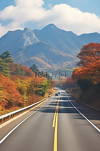 的秋天背景图片_首尔路上的秋天风景和山脉