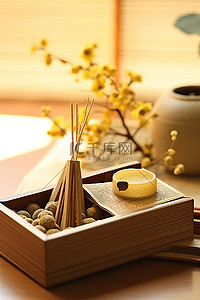 干果干果背景图片_一个木盒，里面有一根黄色的香和一盒干果