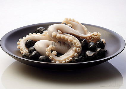 一只章鱼被放在一个碗里，放在石头上