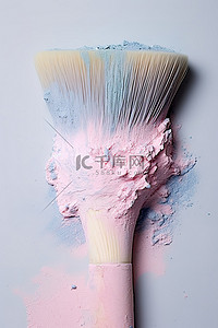 化妆品护肤彩妆背景图片_塑料刷上的粉红色粉末