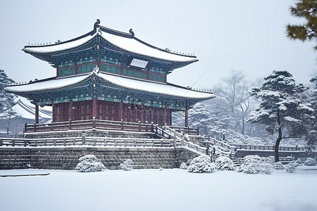 冬天古建筑背景图片_韩国古老的宫殿和花园在降雪中