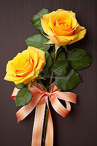 橙色的花背景图片_两片黄色和橙色的玫瑰叶和一把蝴蝶结