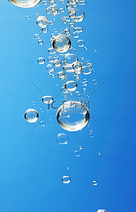 气泡的水背景图片_漂浮在水面以下的气泡的图像