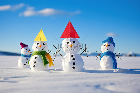 一群色彩缤纷的雪人，地上放着风筝