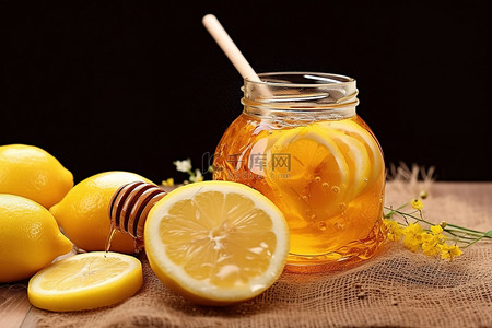 柠檬食物背景图片_在装有柠檬和蜂蜜的罐子里滴几滴蜂蜜
