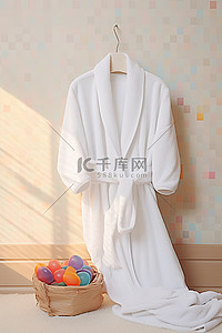 浴背景图片_床上放着白色浴袍，旁边放着毛巾