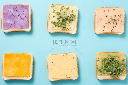 蓝色背景中的六片面包，上面有绿色蔬菜和新鲜香草