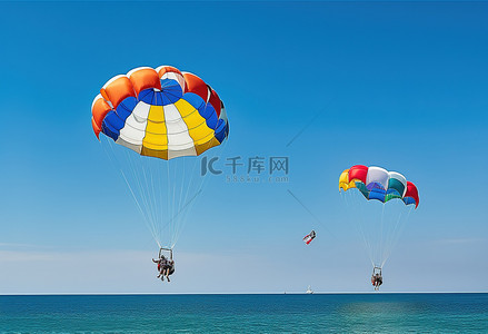 滑翔伞手绘背景图片_两个人在海滩玩滑翔伞