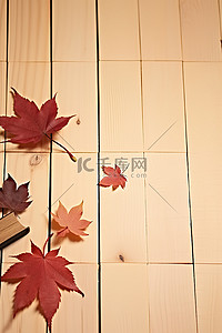 秋银杏叶背景图片_木柜台上的秋字棍和叶