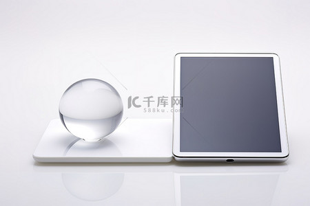 科技地球高科技背景图片_顶部有一个玻璃球的平板电脑