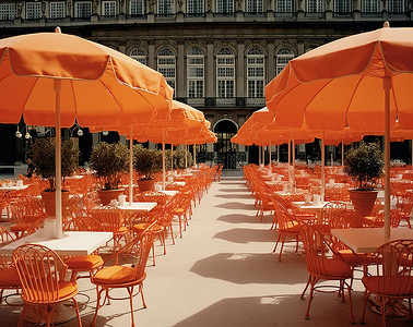 广场椅子背景图片_一套橙色雨伞和一组桌子