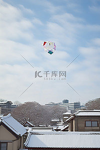 新年快乐背景图片_一只风筝飞过几栋建筑物
