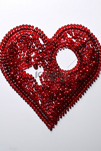 珍珠粒子背景图片_心形与红色串珠珍珠