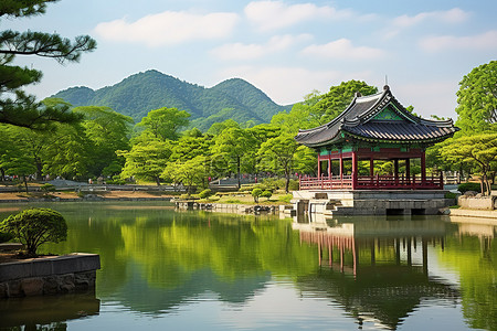 春天植物树木背景图片_一个小亭子和池塘，背景是一座山