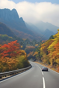 路上的风景背景图片_首尔路上的秋天风景和山脉