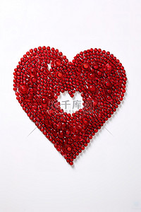 心粒子背景图片_白色背景上由红色珠子制成的心